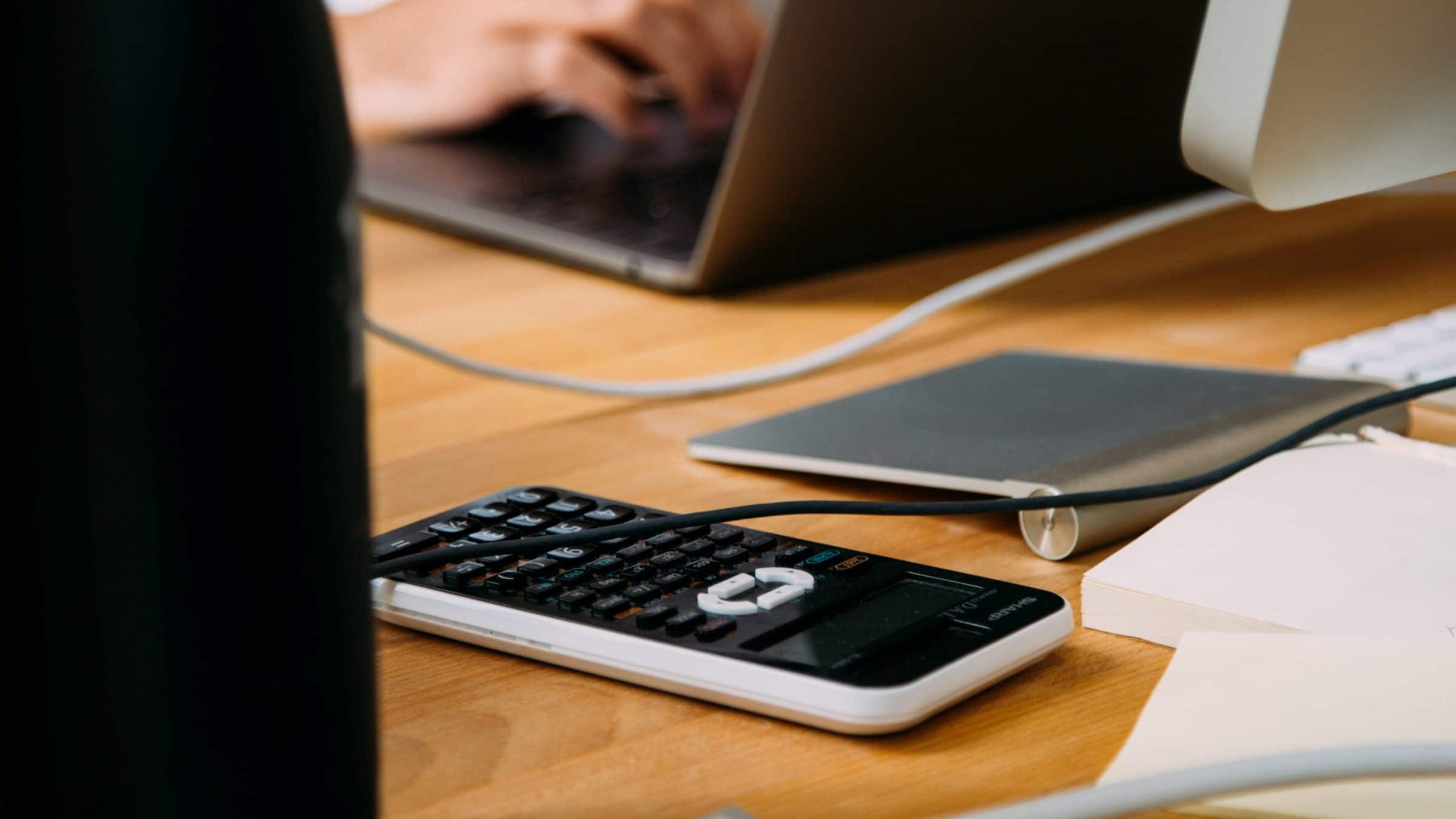 Image of Calculator and Desk Zoomed In