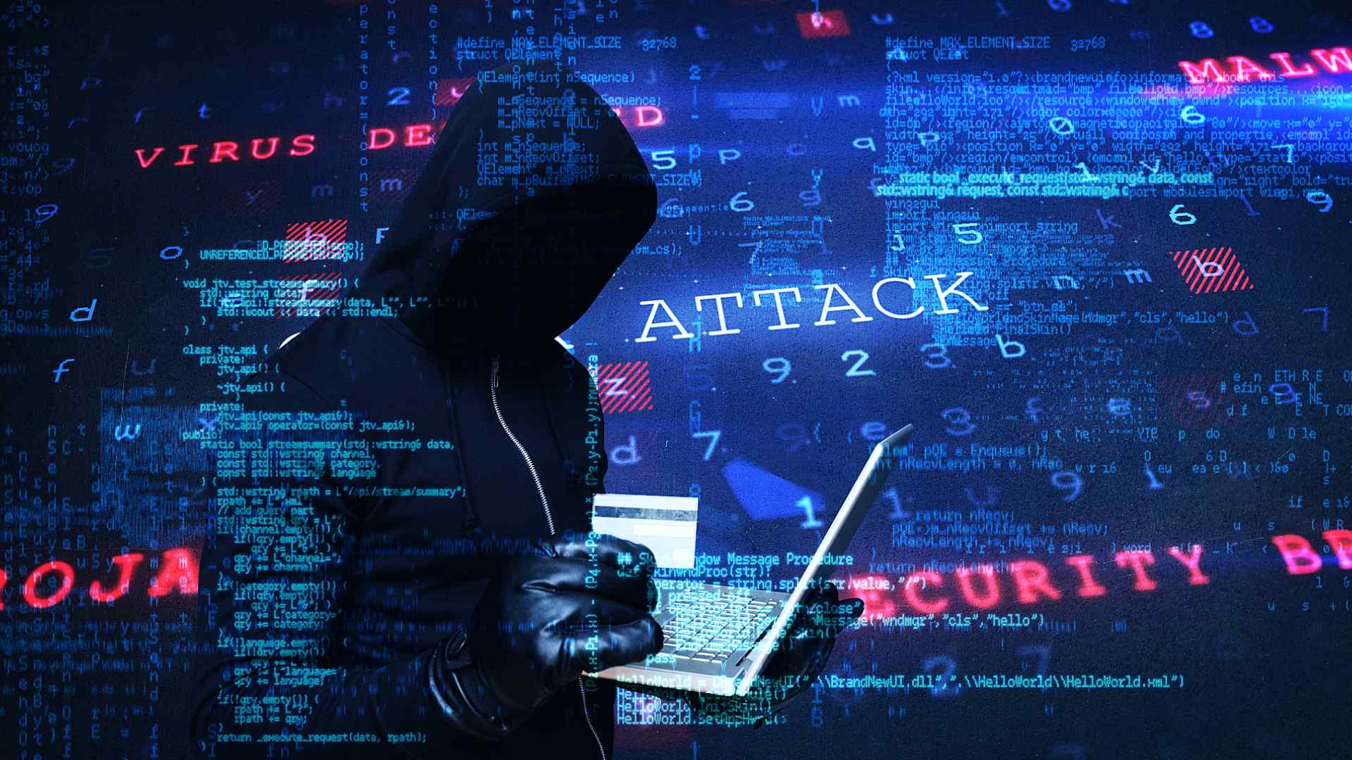 hooded figure standing holding a laptop with text security cybersecurity attack cyberattack virus detected in background