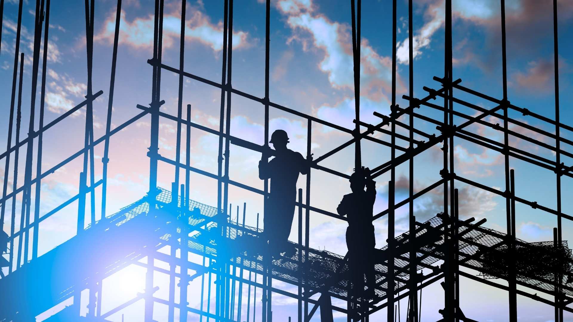 builders standing on a scaffold