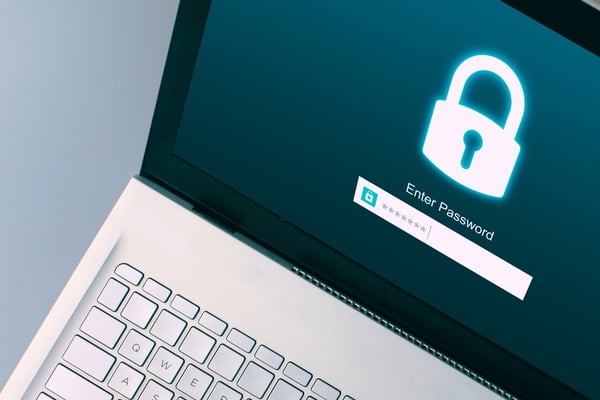 open laptop with a login screen requiring a password or passphrase