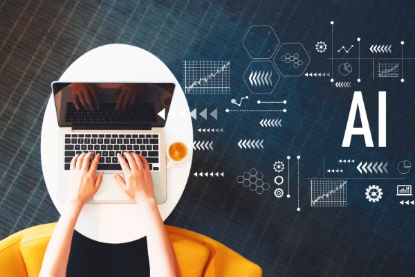 person typing on laptop keyboard sitting on a desk with AI text on the right with graphics surrounding