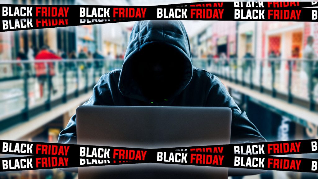 black friday sales banners overlaying a hacker sitting on a laptop computer typing on keyboard performing a cyberattack with a blurred shopping centre in the background